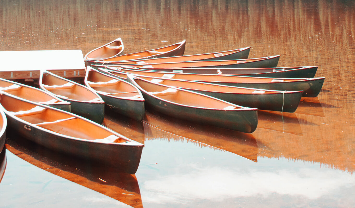 Fiberglass canoes on the lake