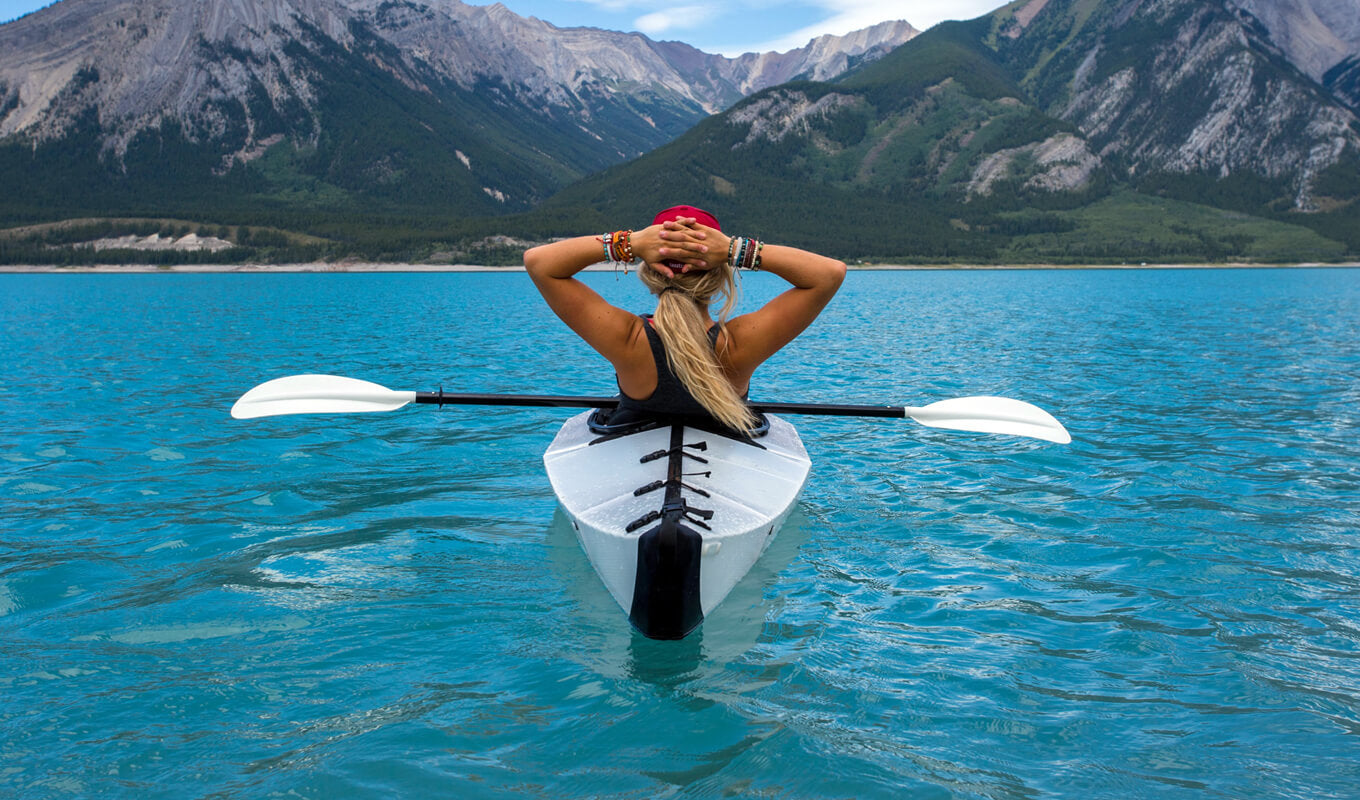 Woman on a white folding kayak