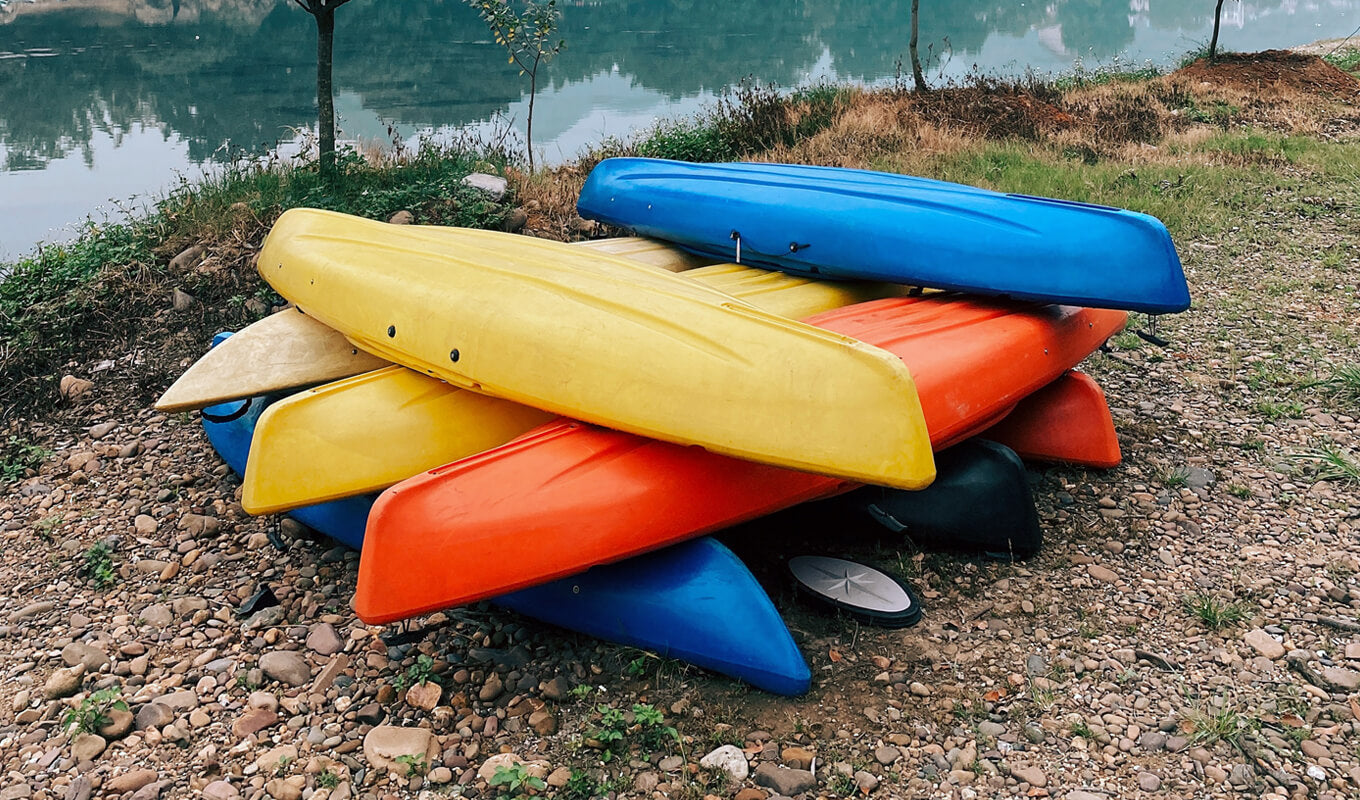 Yellow and orange kayak stacked