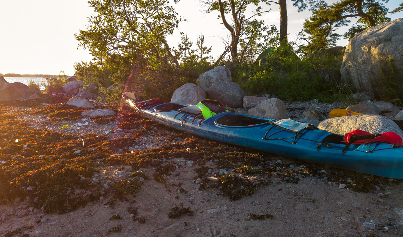 Blue tandem kayak drying under the sun