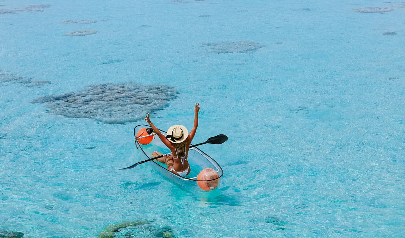 Woman on a transparent kayak
