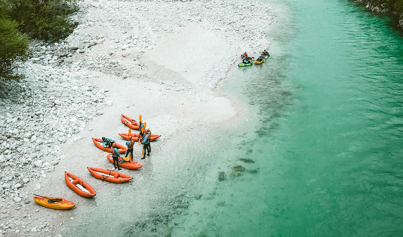 Inflatable kayaks on the river side