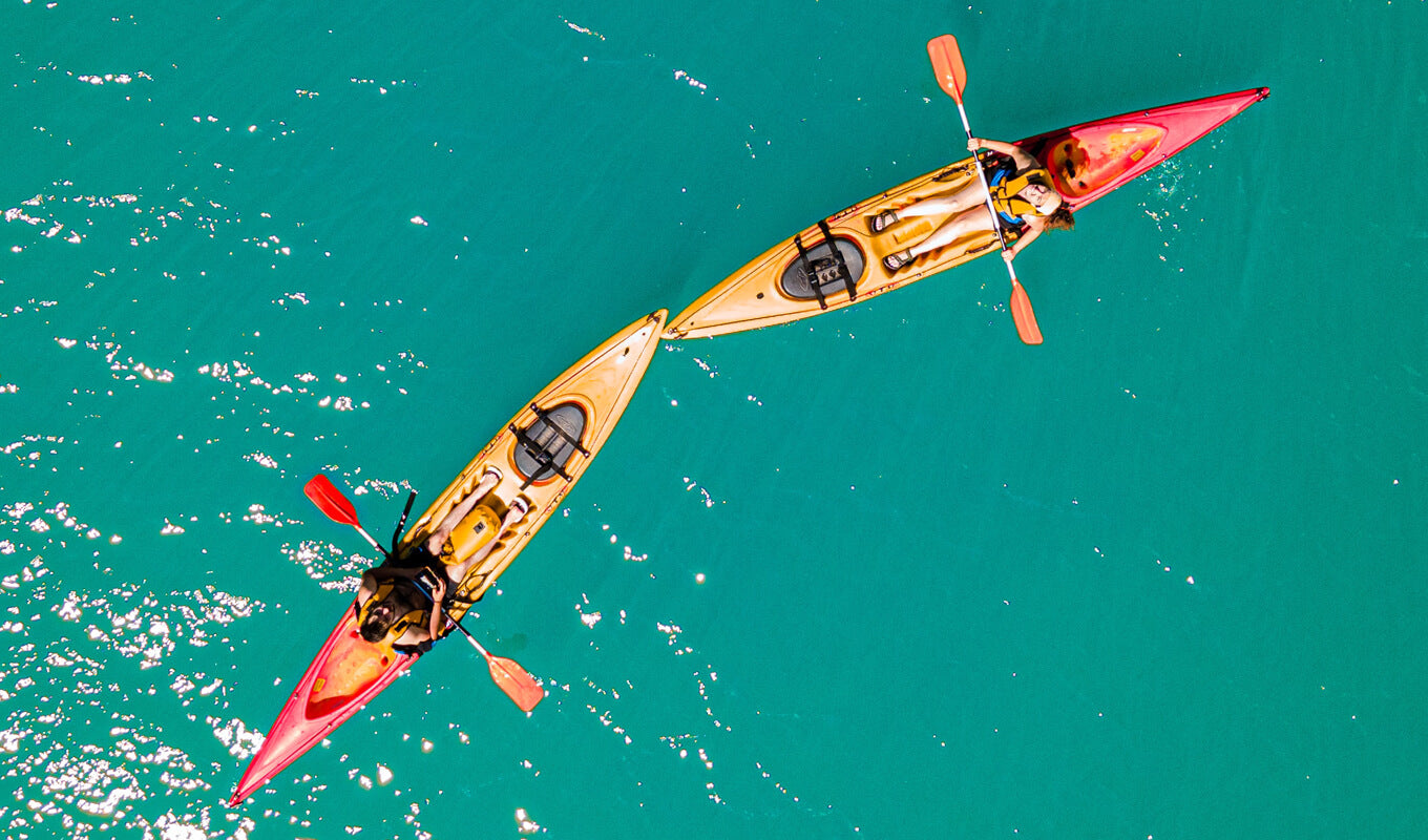 Two kayakers on the middle of the ocean