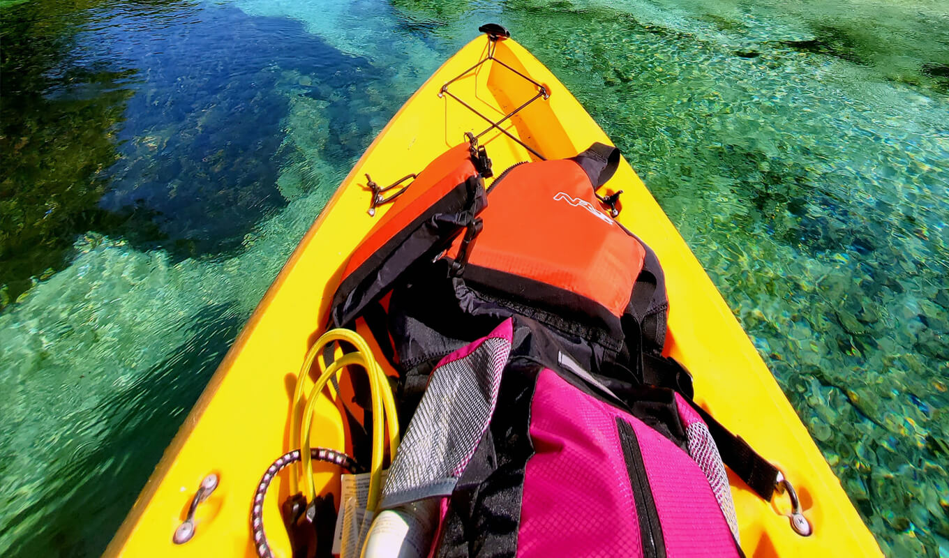 Yellow kayak loaded with items