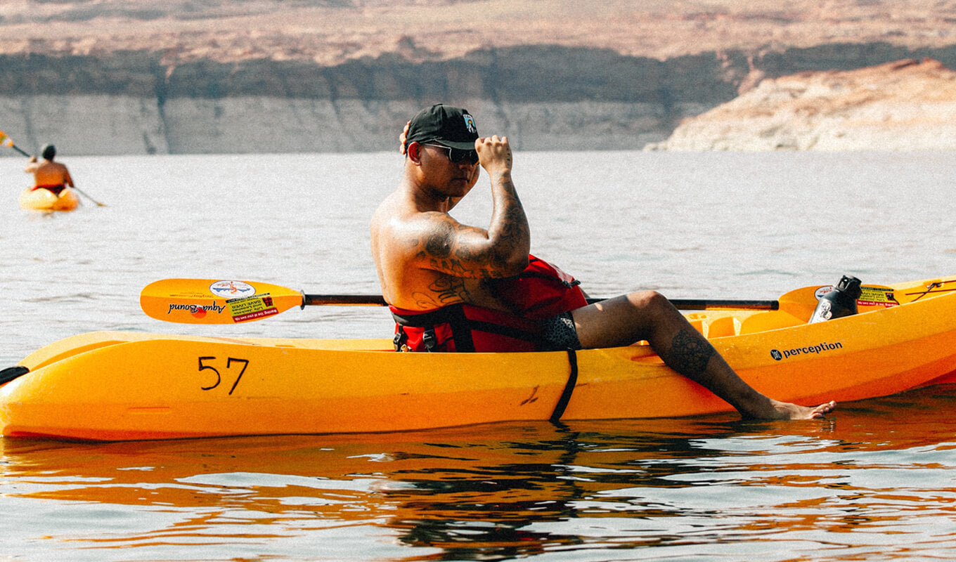 Man on a yellow kayak