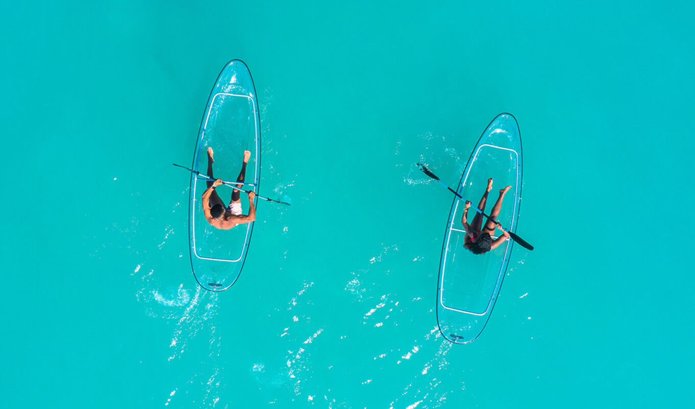 Two kayakers on a transparent kayak