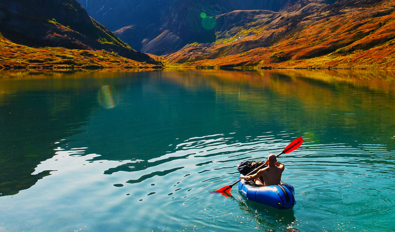 Man Packrafting on a lake