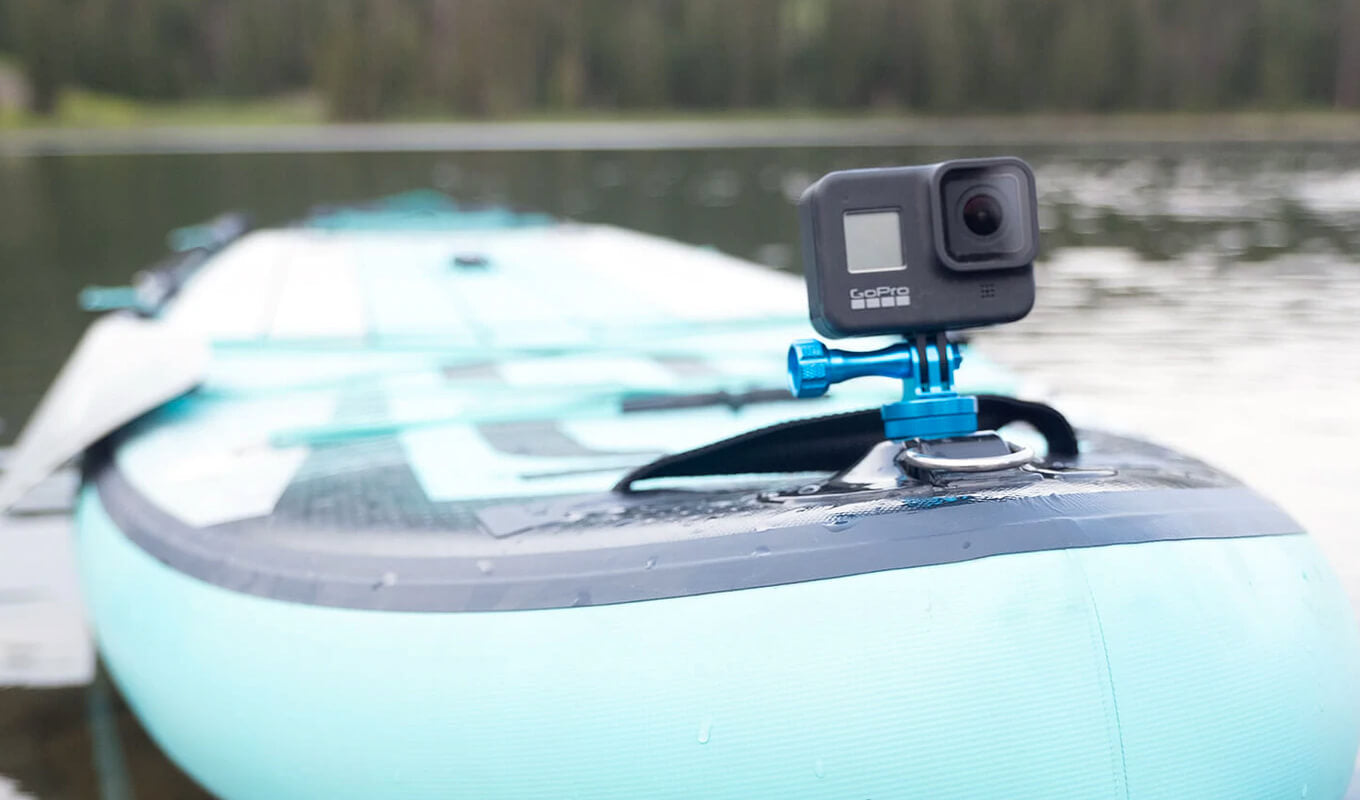 Blue action camera for GoPro mounted on inflatable paddle board