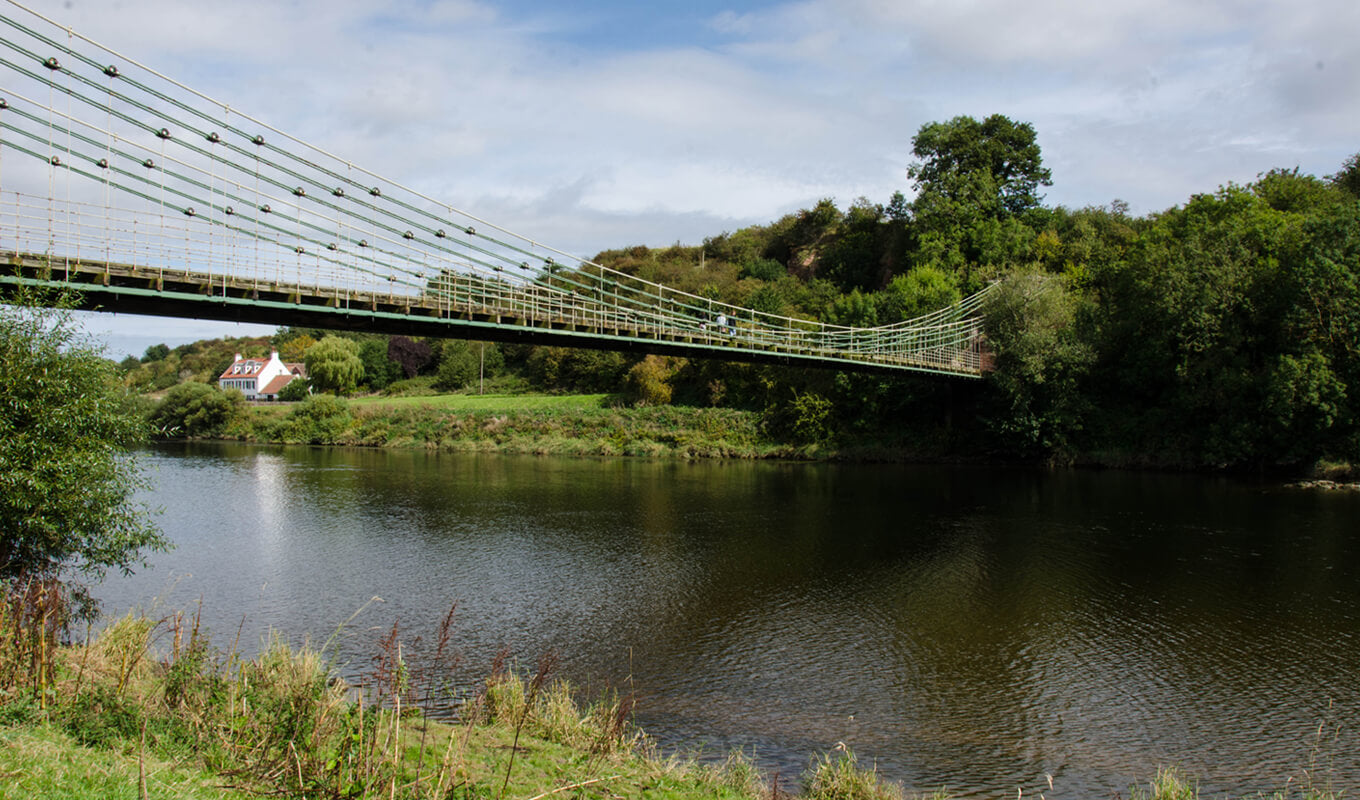 Bridge crossing a river at winter park chain of lakes