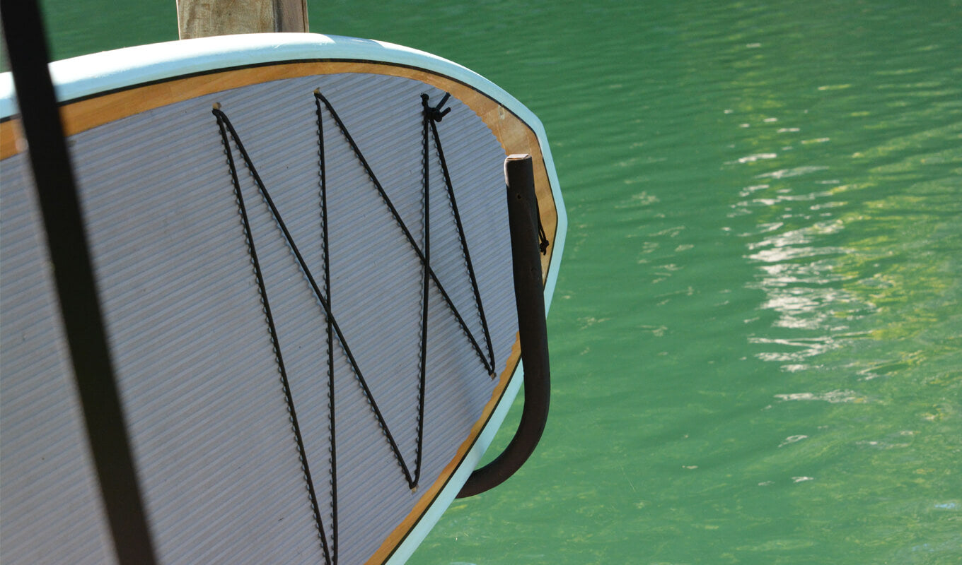 Paddle board hang on a wall rack