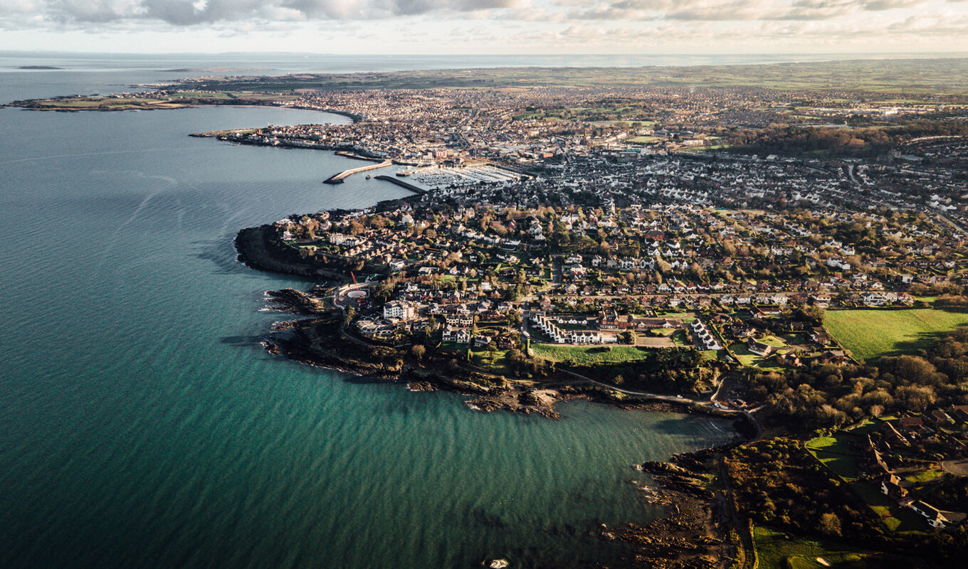 Aerial view of a Northern Ireland city near a body of water