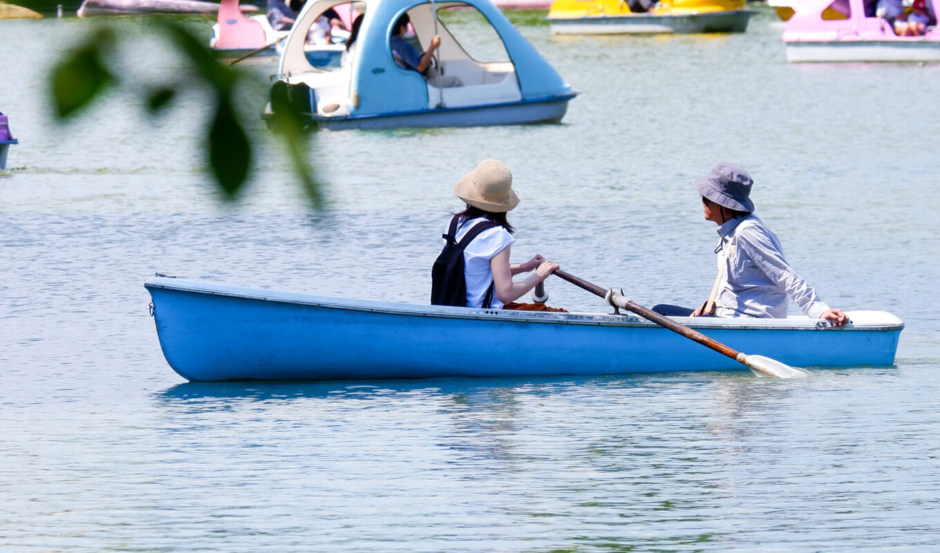 Man and a woman on a blue canoe