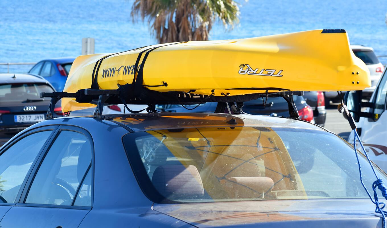 Ocean kayak yellow tie down on rack system