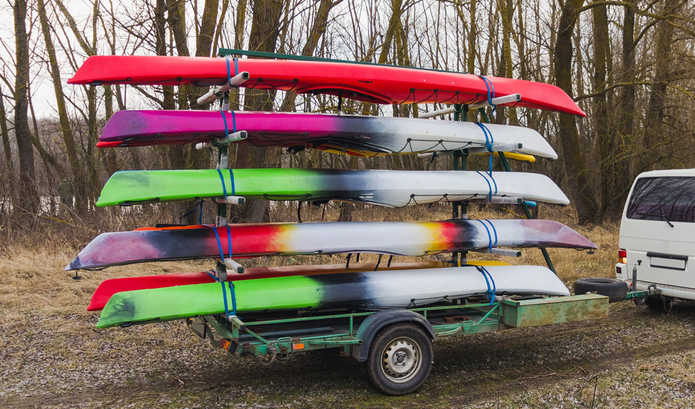 Transporting kayak using a trailer