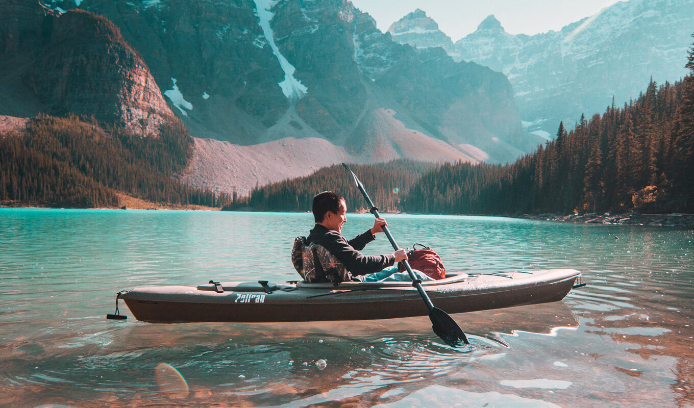 Man kayaking on a lake
