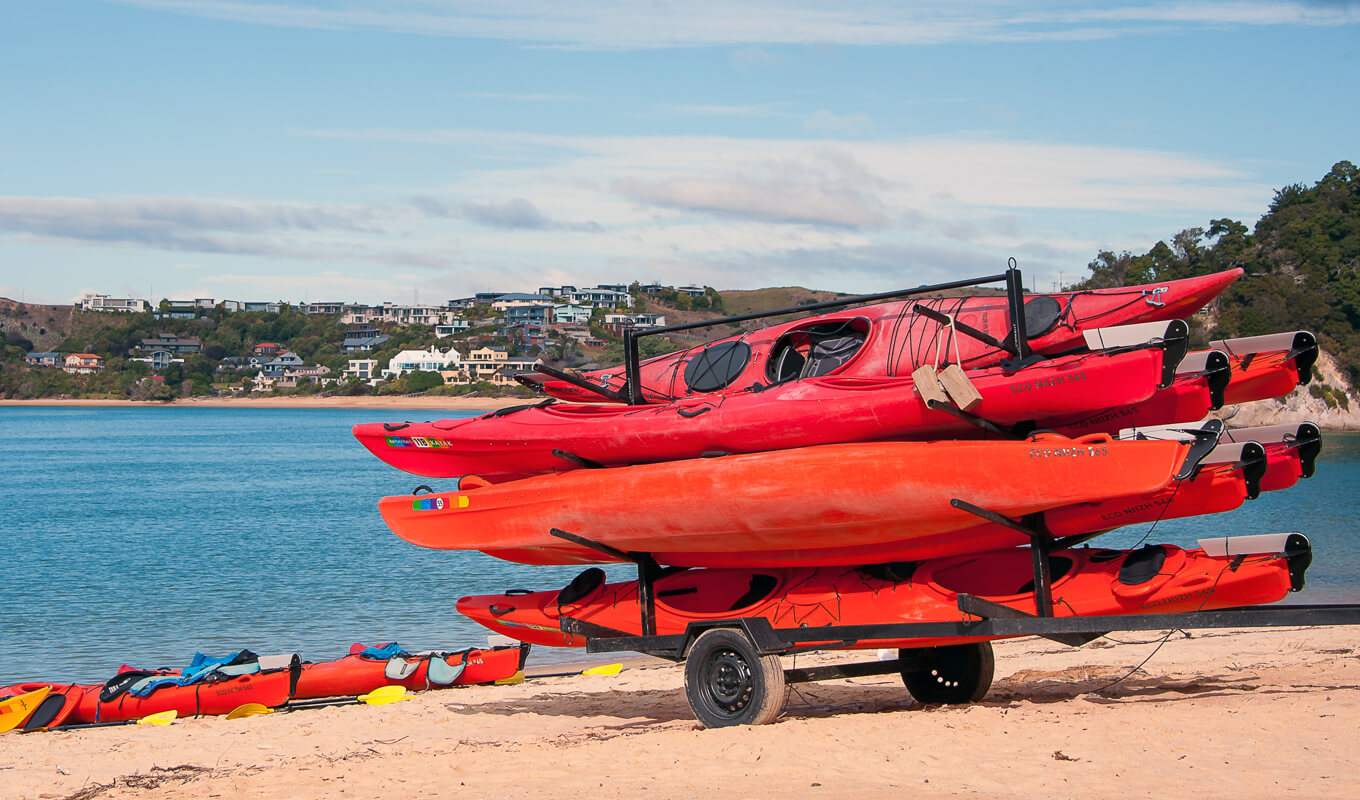 Pile of kayaks with a rudder and a skeg