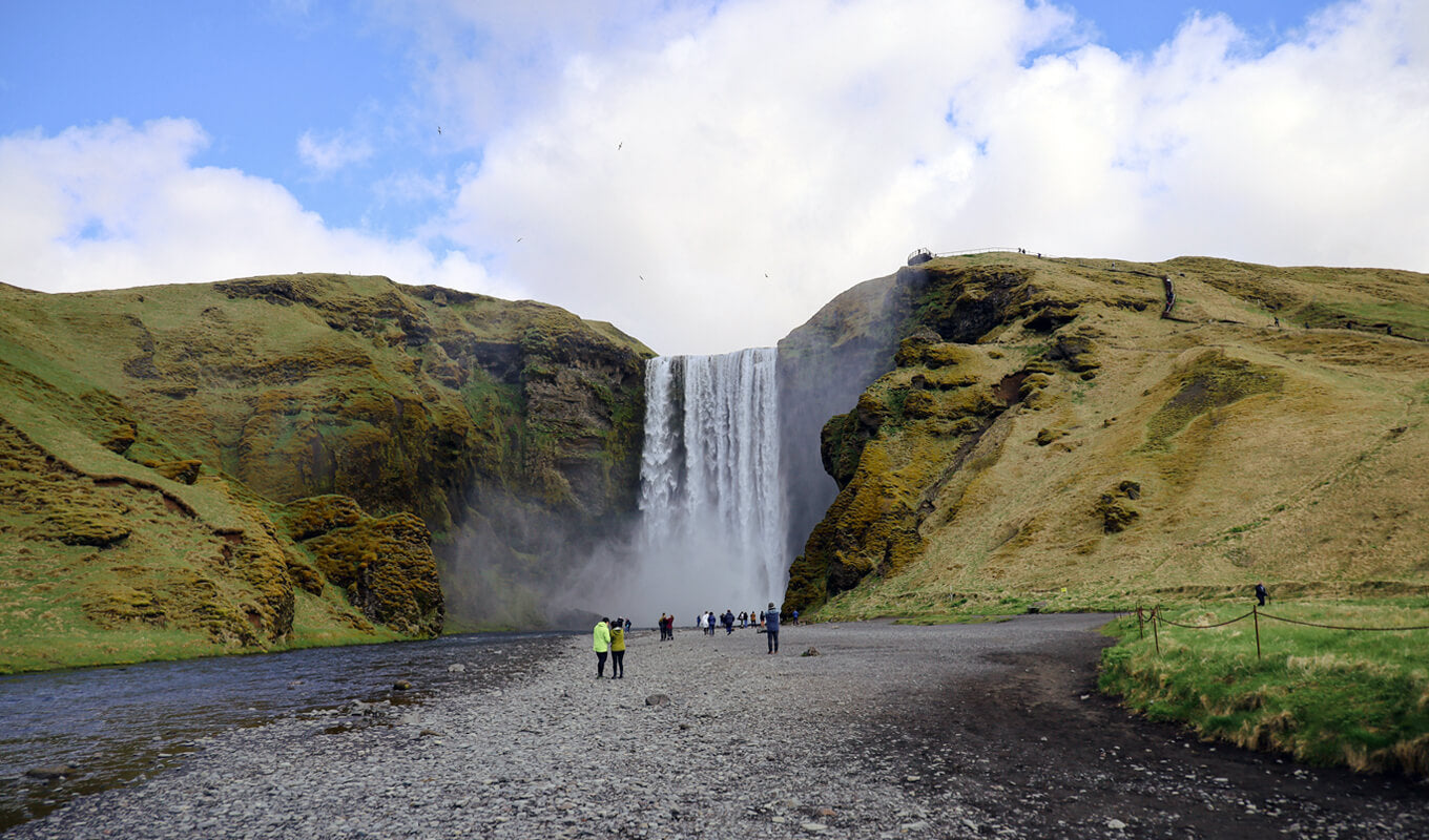 Paddle boarding in SKÓGAFOSS WATERFALL