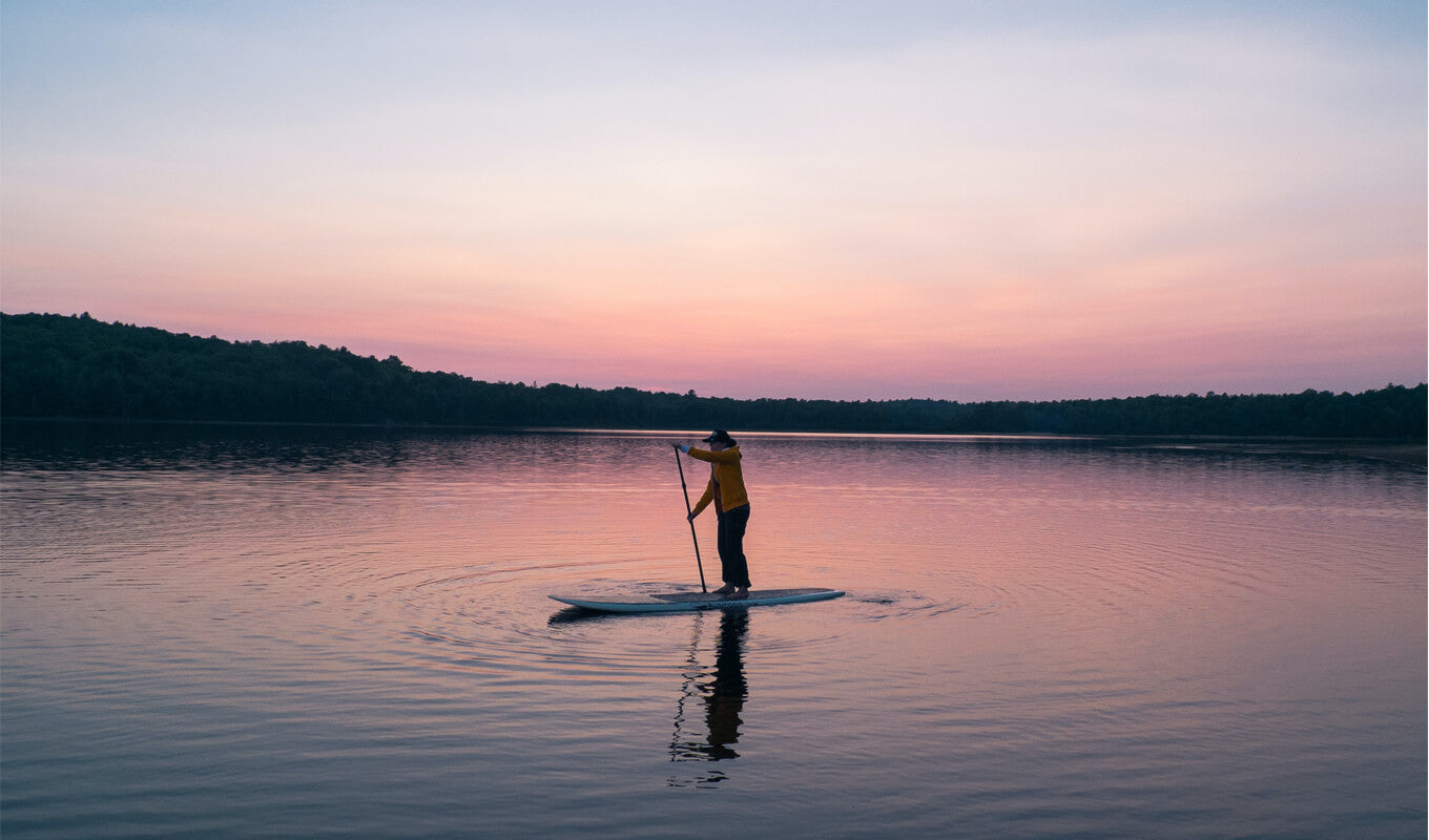 Man paddle boarding in lake