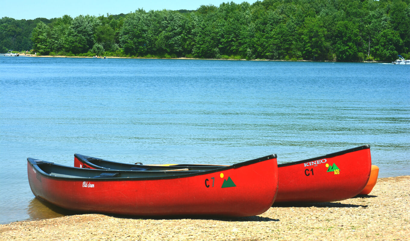Two red solo canoe