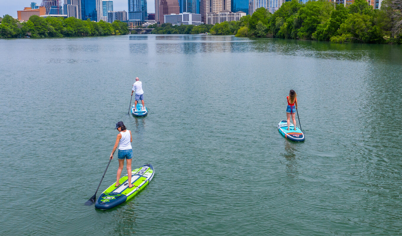 Group of paddle boarders improving their skills