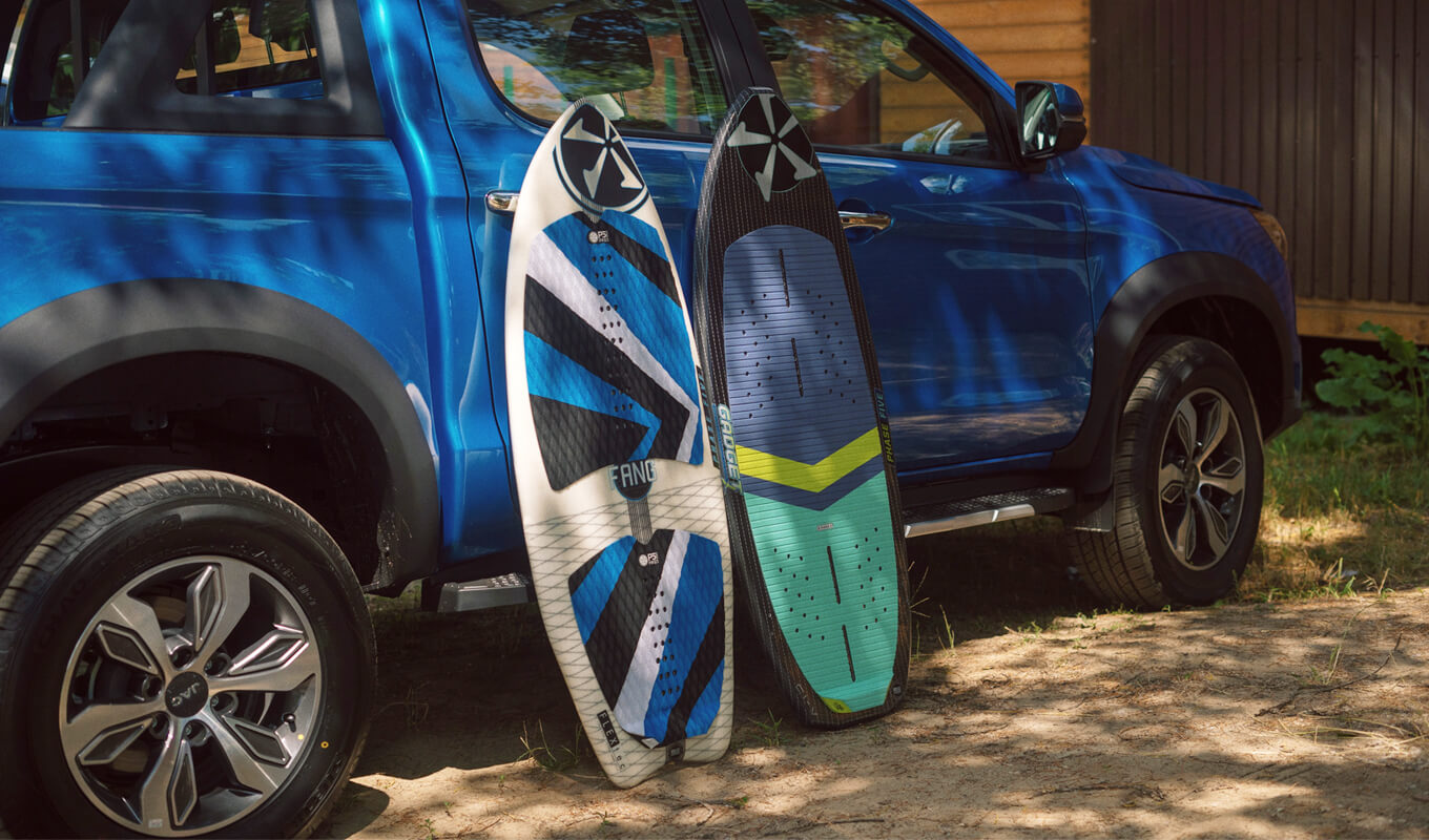 Boogie boards leaning in a truck