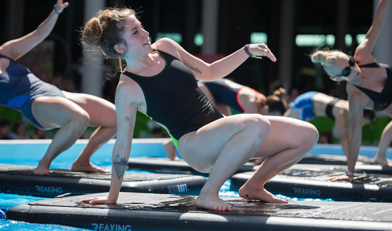 Women doing yoga on a floating mat
