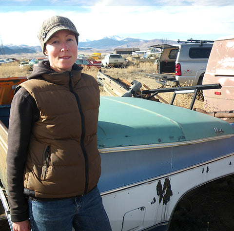 Pyper in the junkyard with the 1969 Chevy Nova hood