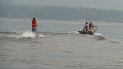 Waterskiing at Shuswap Lake behind a small boat