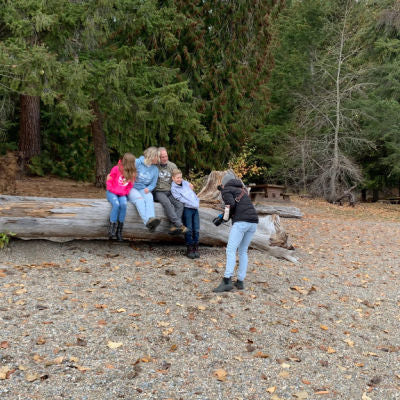 Family talking to a photographer at Shuswap Lake