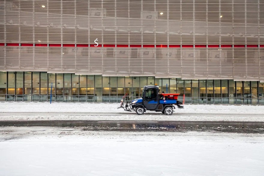 blue forklift in the snow