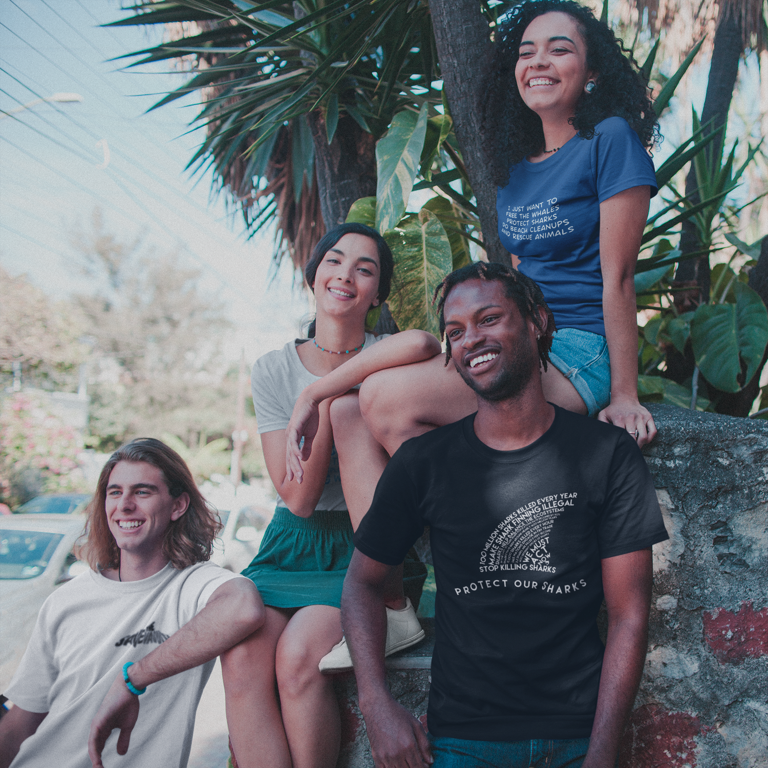 group of friends smiling while wearing sharonkornman shirts - ethically and sustainably made products that give back to non-profit organizations