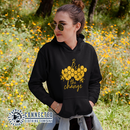 Model Wearing Black Bee The Change Unisex Hoodie - sweetsherriloudesigns - Ethically and Sustainably Made - 10% donated to The Honeybee Conservancy