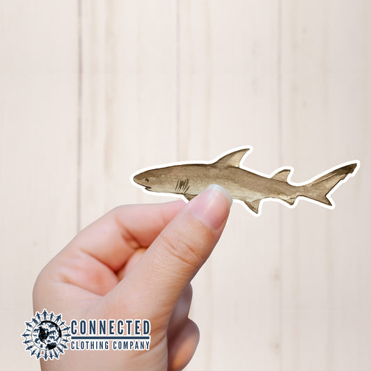 Hand Holding Lemon Shark Watercolor Sticker - sweetsherriloudesigns - Ethical and Sustainable Apparel - portion of profits donated to shark conservation