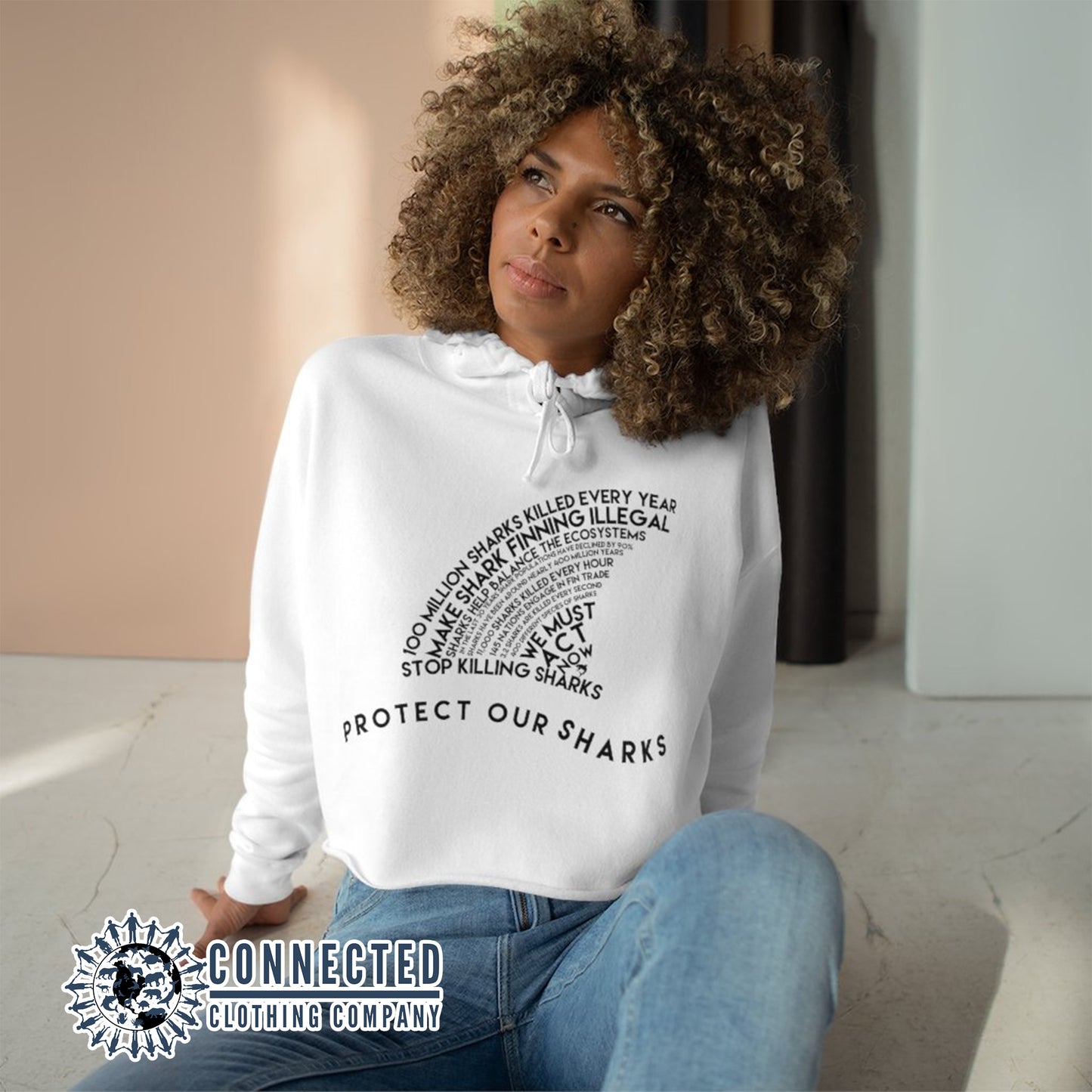 Model Wearing White Protect Our Sharks Crop Hoodie - sweetsherriloudesigns - Ethically and Sustainably Made - 10% of profits donated to shark conservation and ocean conservation