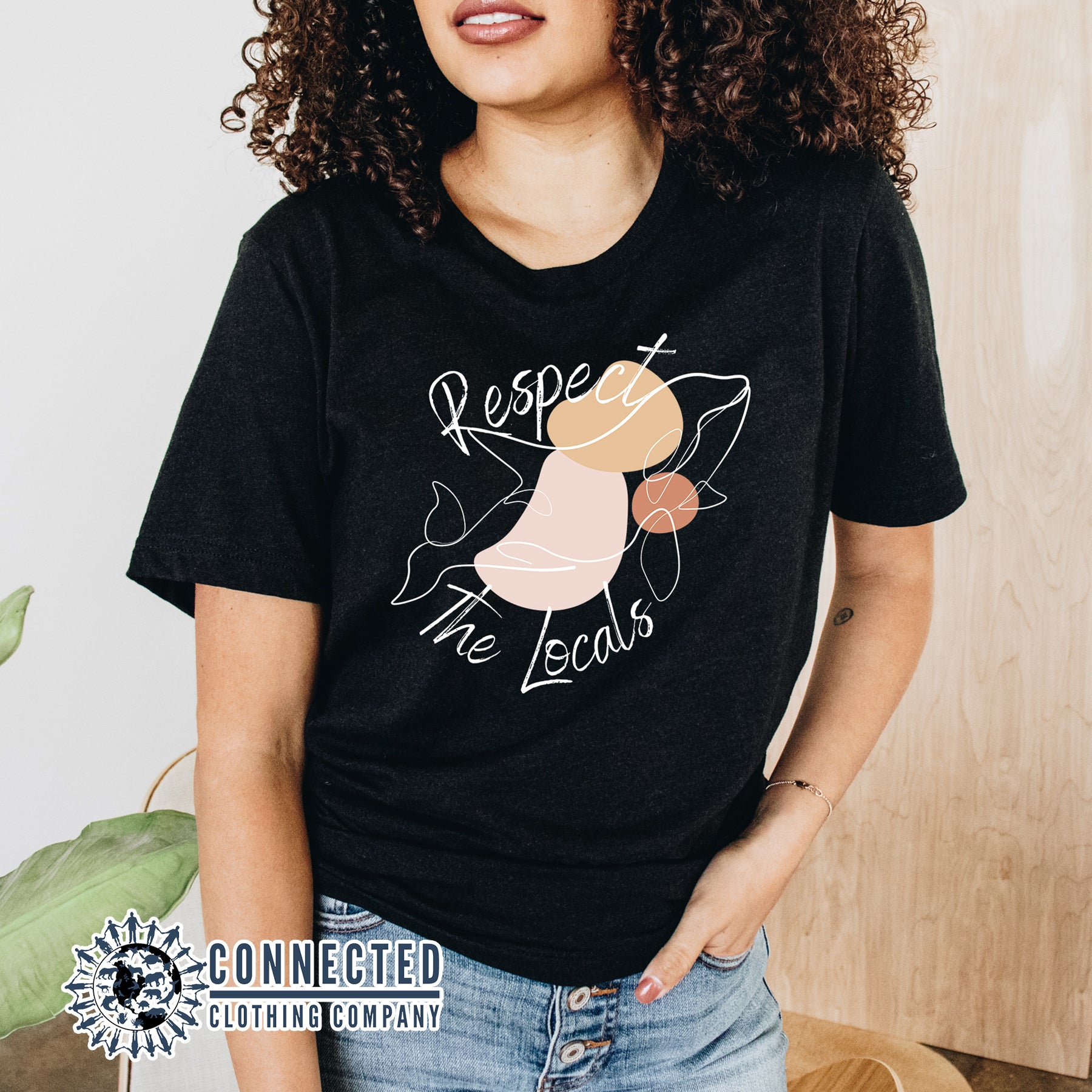  Model Wearing Black Respect The Locals Orca Unisex Short-Sleeve Tee - sweetsherriloudesigns - Ethically and Sustainably Made - 10% of profits donated to orca conservation