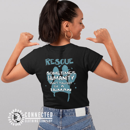 Model Wearing Black Show Humanity Short-Sleeve Tee reads "Rescue. Sometimes humanity isn't taught by a human" - sweetsherriloudesigns - Ethically and Sustainably Made - 10% donated to animal rescue