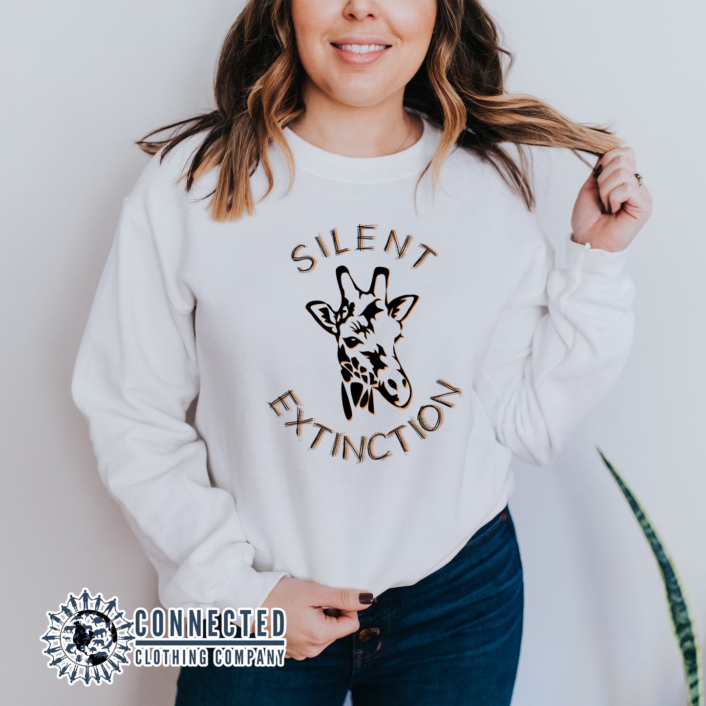 Model Wearing White Giraffe Silent Extinction Unisex Sweatshirt - sweetsherriloudesigns - 10% of profits donated to the Giraffe Conservation Foundation