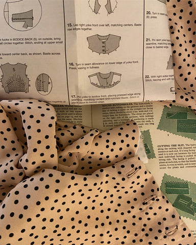 Pattern instructions and pale pink polka dot fabric