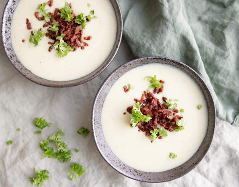 Creamy homemade cauliflower soup with potatoes and bacon