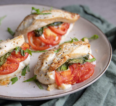 Easy Chicken Breast Dinner Recipe Filled with Cheese, Tomato, and Herbs