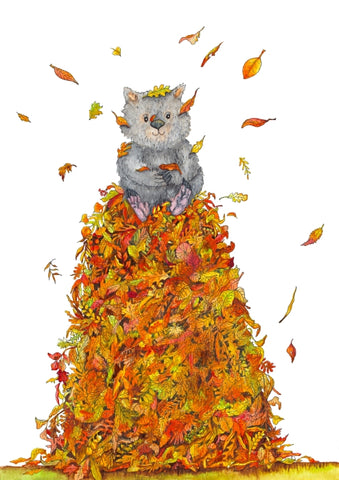 a cute wombat sitting on a massive pile of autumn leaves