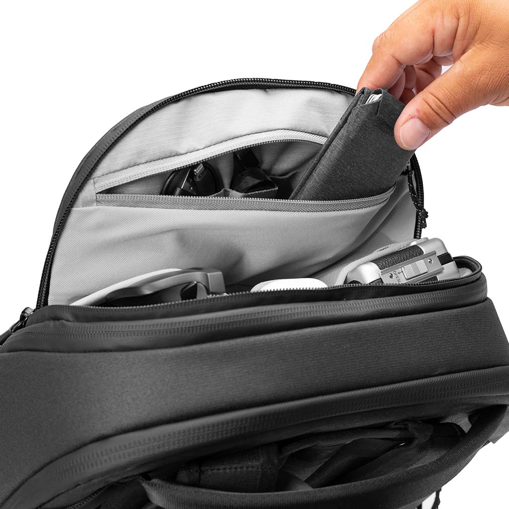 Zip pocket inside the Black 30L Travel Backpack pockets