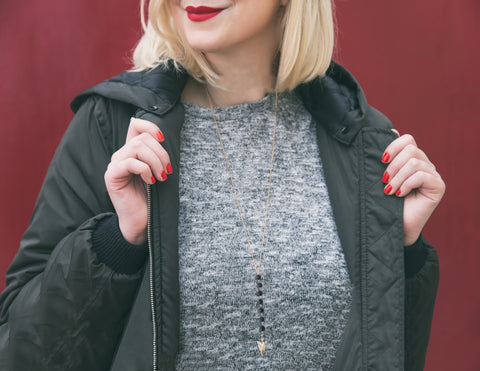 A Woman Wearing 7 Chakra Aromatherapy Diffuser Necklace