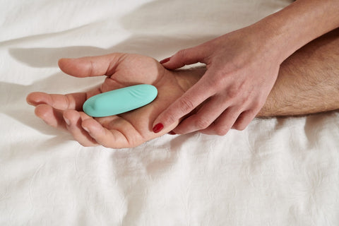 sex toy in male hand