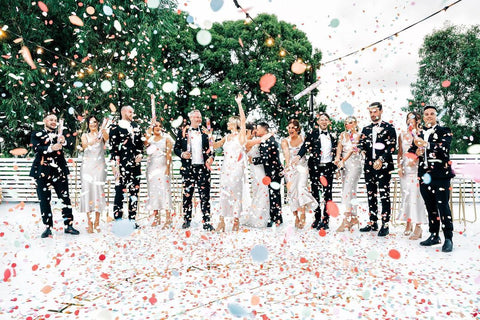 wedding photo with confetti white themed