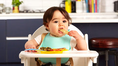 baby on chair eating