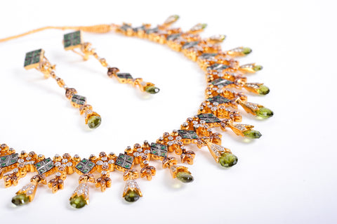 Handcrafted 22k gold necklace set with earrings studded with tourmaline and quartz.