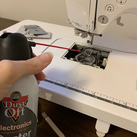 Using canned air on the sewing machine