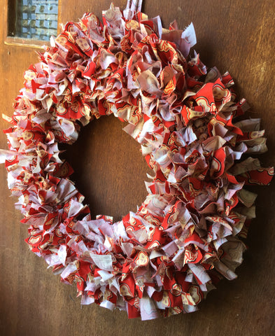 Red and white scrap fabric wreath made with skull fabric