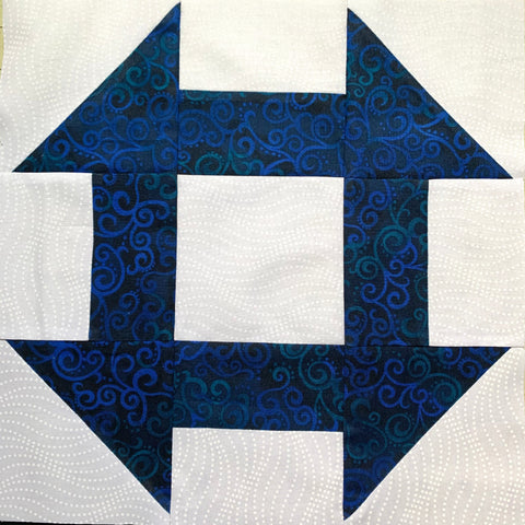 Churn Dash Quilt Block  - made with white and dark blue fabric prints